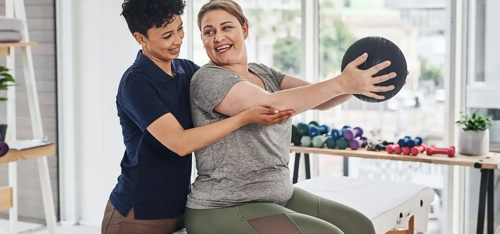 Physical therapist guiding a patient through an exercise